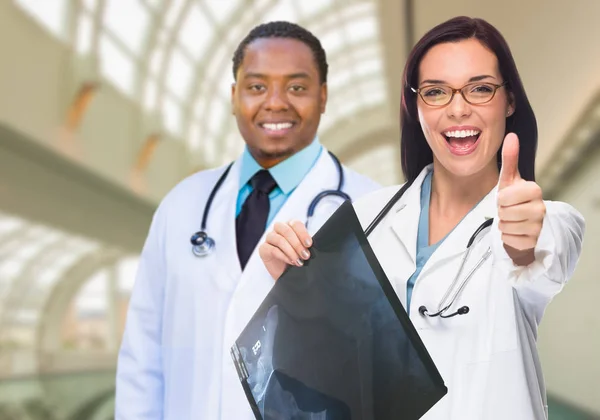 Female and Male Caucasian and African American Doctors in Hospit — Stock Photo, Image