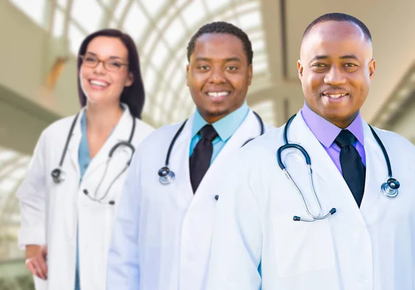 Female and Male Caucasian and African American Doctors in Hospit — Stock Photo, Image