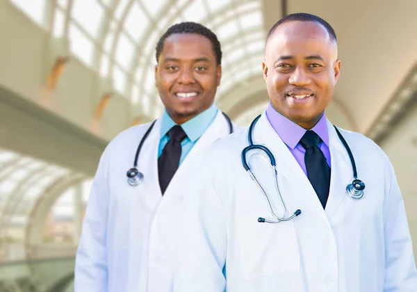 Two African American Male Doctors Inside Hospital Office Royalty Free Stock Photos