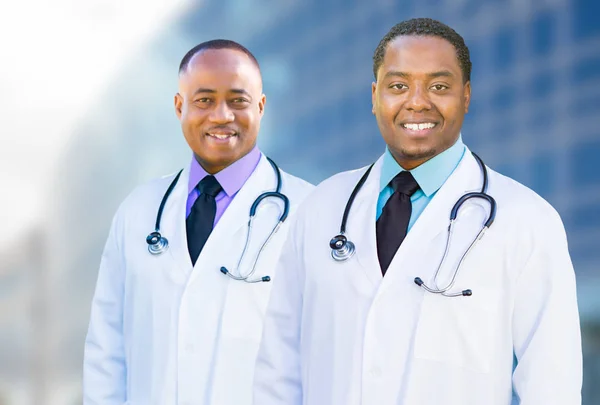 African American Male Doctors Outside of Hospital Building Royalty Free Stock Images