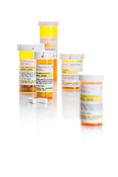 Non-Proprietary Medicine Prescription Bottles and Pills Isolated on White