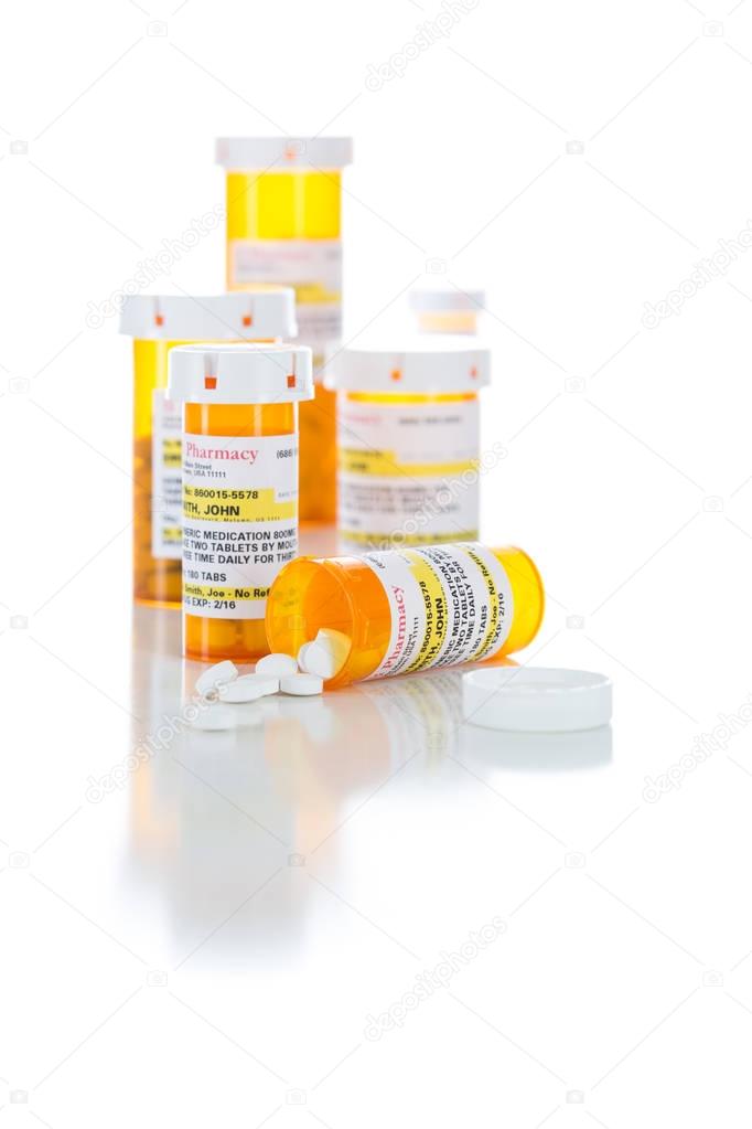 Non-Proprietary Medicine Prescription Bottles and Spilled Pills Isolated on White