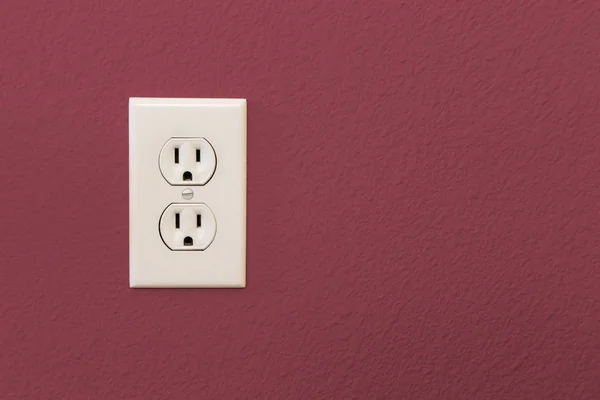 Electrical Sockets In Colorful Burgundy Wall — Stock Photo, Image