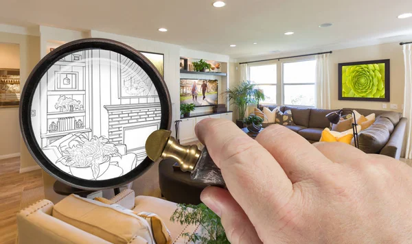 Lupa de mano que sostiene la lupa que revela el dibujo personalizado del diseño de la sala de estar y la combinación de fotos — Foto de Stock