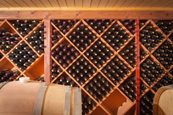 Wine Barrels and Bottles Age Inside Cellar — Stock Photo, Image