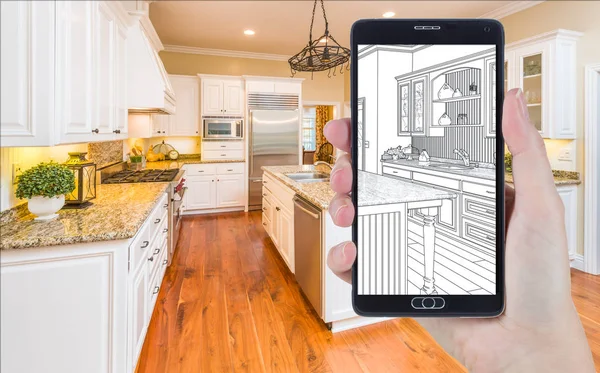 Hand Holding Smart Phone Displaying Drawing of Kitchen Photo Beh — Stock Photo, Image