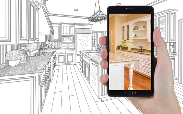 Hand Holding Smart Phone Displaying Photo of Kitchen Drawing Beh — Stock Photo, Image