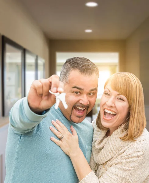 Couple Holding House Keys Inside Hallway of Their New Home — Stock Photo, Image