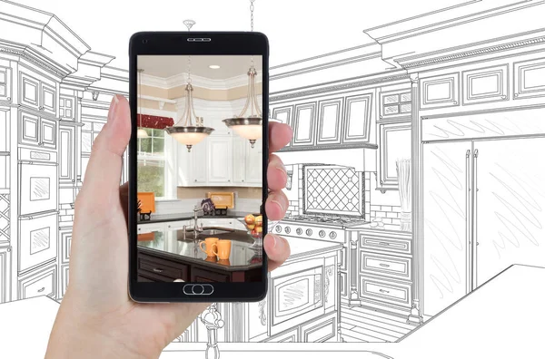 Hand Holding Smart Phone Displaying Photo of Kitchen Drawing Beh — Stock Photo, Image