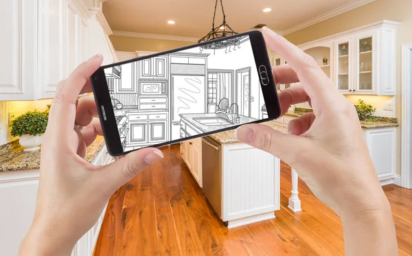 Hands Holding Smart Phone Display Drawing of Kitchen Photo Behind — Stok Foto