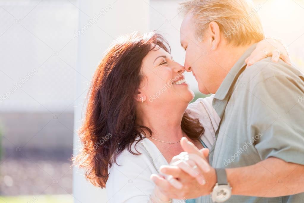 Middle Aged Couple Enjoy A Romantic Slow Dance Outside