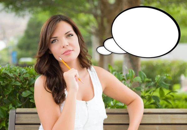 Thoughtful Young Woman with Pencil and Blank Thought Bubble. — Stock Photo, Image