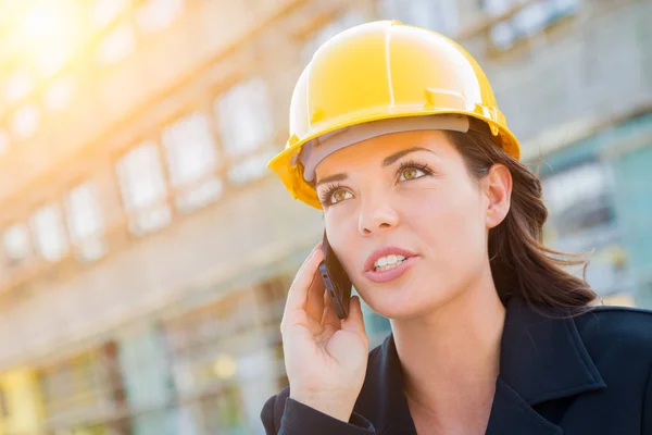 Professional Female Contractor Wearing Hard Hat at Contruction Site Using Cell Phone — Stock Photo, Image