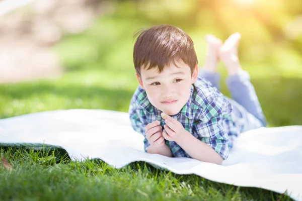 Mixed Race Chinese and Caucasian Young Boy Relaxing Outside On T — Stock Photo, Image