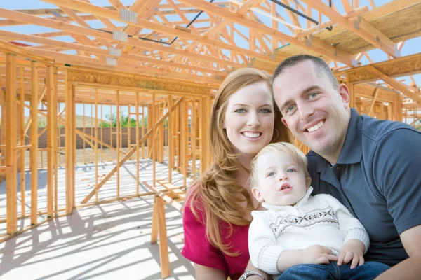 Young Military Family Inside The Framing of Their New Home at Construction Site. — Stock Photo, Image