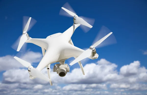 Unmanned Aircraft System (UAV) Quadcopter Drone In The Air. — Stock Photo, Image