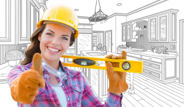 カスタム キッチン図面の前にレベルを持って、親指で女性建設労働者 — ストック写真