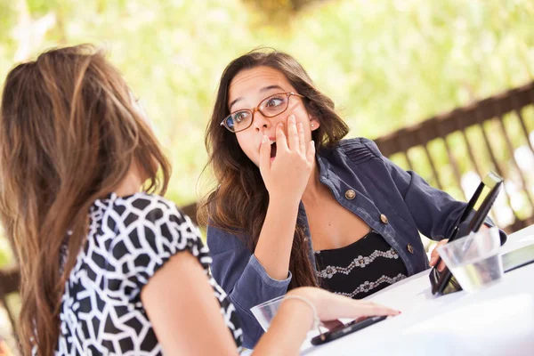 Expressive Young Adult Girlfriends Using Their Computer Electronics Outdoors — Stock Photo, Image