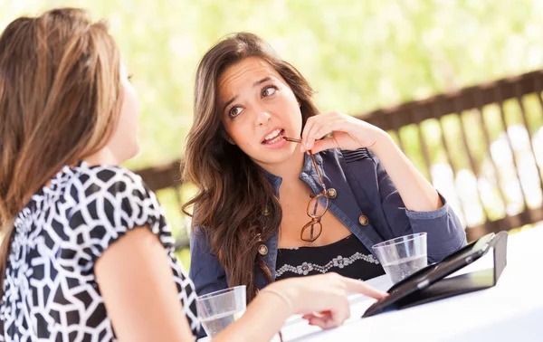 Expressive Young Adult Girlfriends Using Their Computer Electronics Outdoors — Stock Photo, Image