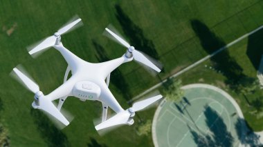 Unmanned Aircraft System (UAV) Quadcopter Drone In The Air Over A Park. clipart