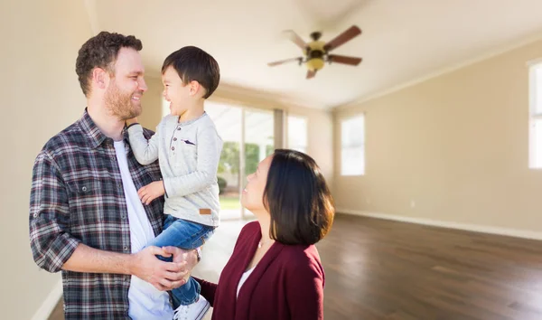 Young Mixed Race Caucasian and Chinese Family Inside Empty Room with Wood Floors. — Stock Photo, Image