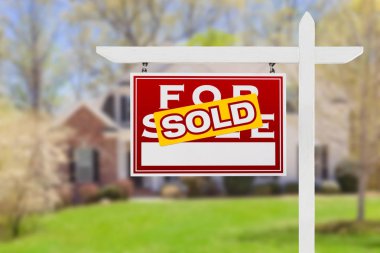 Left Facing Sold For Sale Real Estate Sign In Front of House. clipart