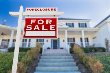 Right Facing Foreclosure For Sale Real Estate Sign in Front of House. clipart