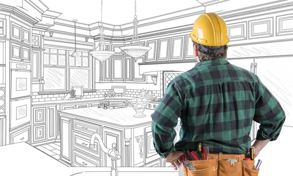 Male Contractor with Hard Hat and Tool Belt Looking At Custom Kitchen Drawing On White. — Stock Photo, Image