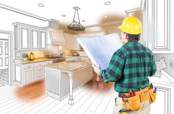 Male Contractor with Hard Hat and Plans Looking At Custom Kitchen Drawing Photo Combination On White.