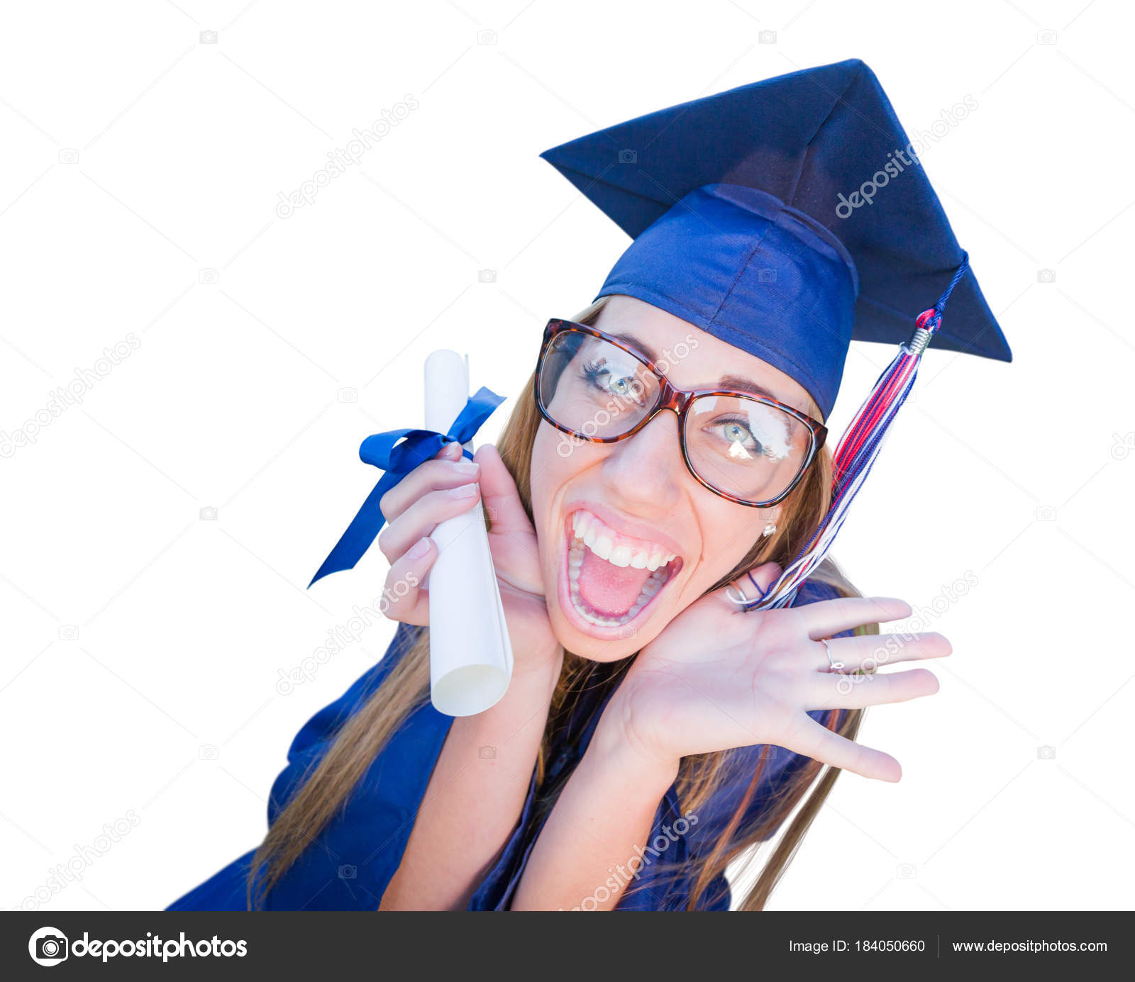 Goofy Graduating Young Girl In Cap and Gown Isolated on a White Background.  — Stock Photo © Feverpitch #184050660