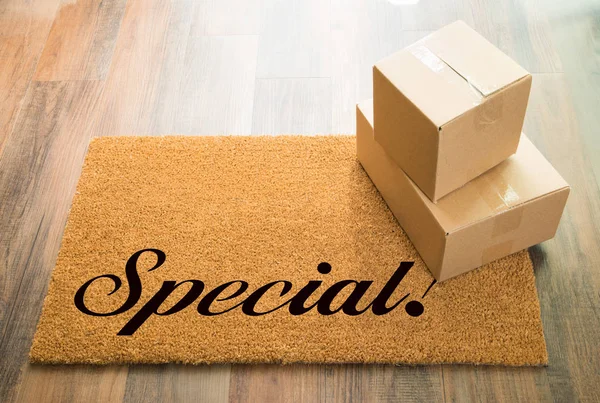 Special Welcome Mat On Wood Floor With Shipment of Boxes — Stock Photo, Image