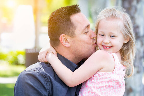 Young Caucasian Father and Daughter Having Fun At The Park