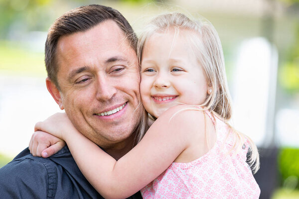 Young Caucasian Father and Daughter Having Fun At The Park