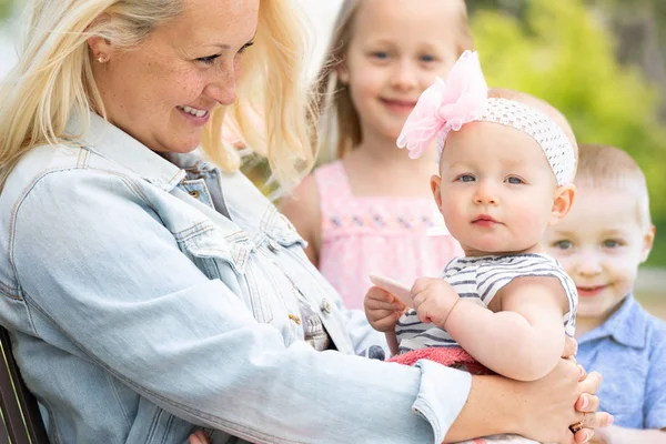 Young Caucasian Mother and Children At The Park — Stock Photo, Image