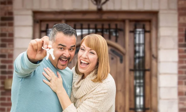 Mixed Race Couple In Front of Front Door of New House Holding Keys — Stock Photo, Image