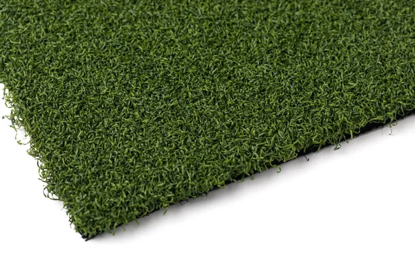 Sekce umělé trávy na bílém pozadí — Stock fotografie