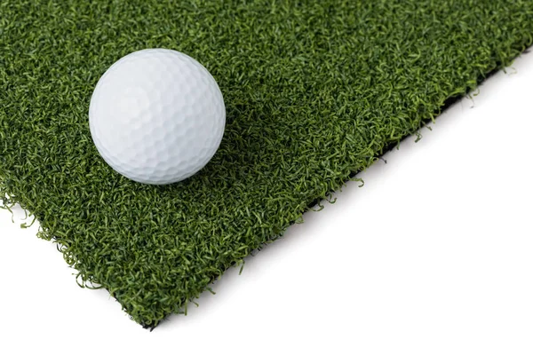 Golf Ball Resting on Section of Artificial Turf Grass On White Background — Stock Photo, Image