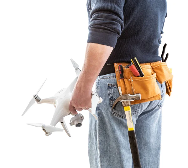 Construction Worker and Drone Pilot With Toolbelt Holding Quadcopter Drone Isolated on White Background — 스톡 사진