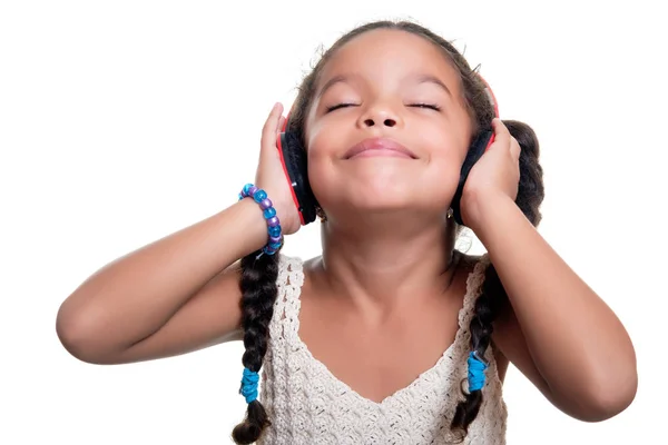 Cute african american small girl listening to music on wireless — Stock Photo, Image