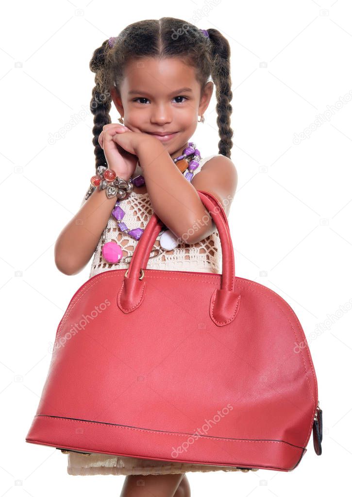 Cute african american small girl dressed up as an adult woman wi