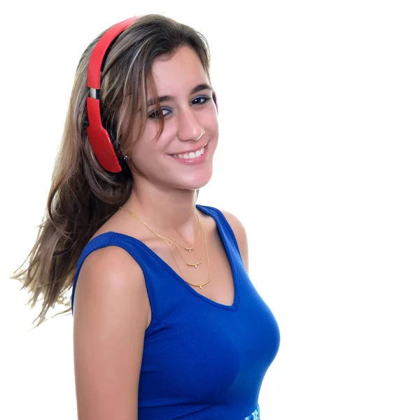 Teenage girl listening to music on wireless headphones isolated — Stock Photo, Image