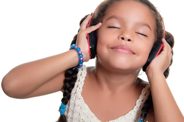 Cute african american small girl listening to music on wireless — Stock Photo, Image