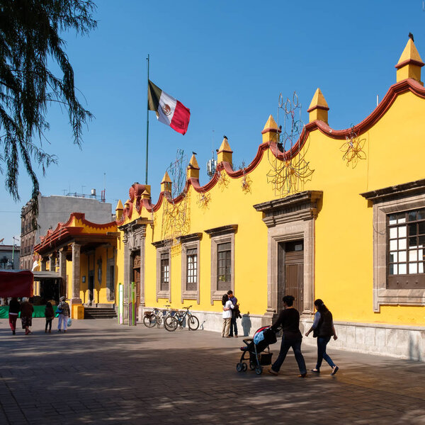 People next to the colonial Town Hall Palace at Coyoacan in Mexico City
