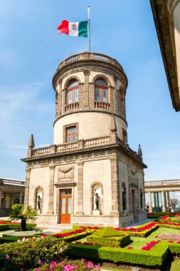 Beautiful gardens and tower on top of Chapultepec Castle in Mexico City clipart