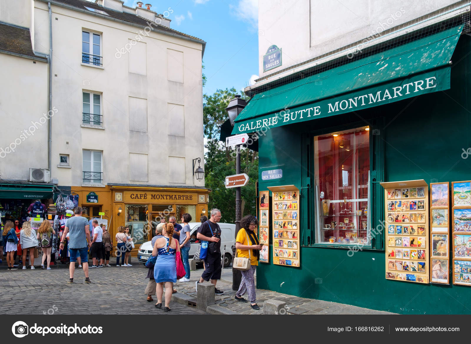 Typical cafes and art galleries in Montmartre, Paris Stock Editorial Photo © kmiragaya 166816262