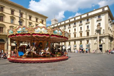 Tourists and locals at  Piazza della Repubblica in Florence clipart