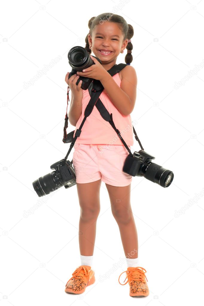Small multiracial girl carrying three professional cameras