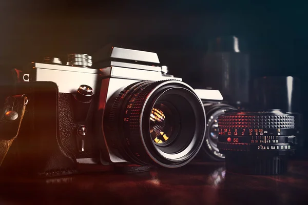 Vintage professional cameras and lenses — Stock Photo, Image