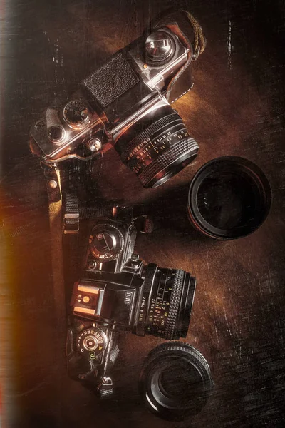Vintage styled image of film cameras and lenses — Stock Photo, Image