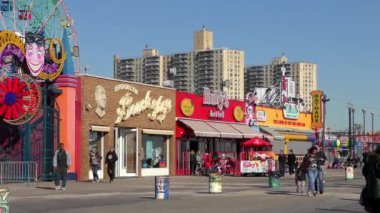 Unidentified people on the Riegelmann Boardwalk on Coney Island, in New York City, 2018